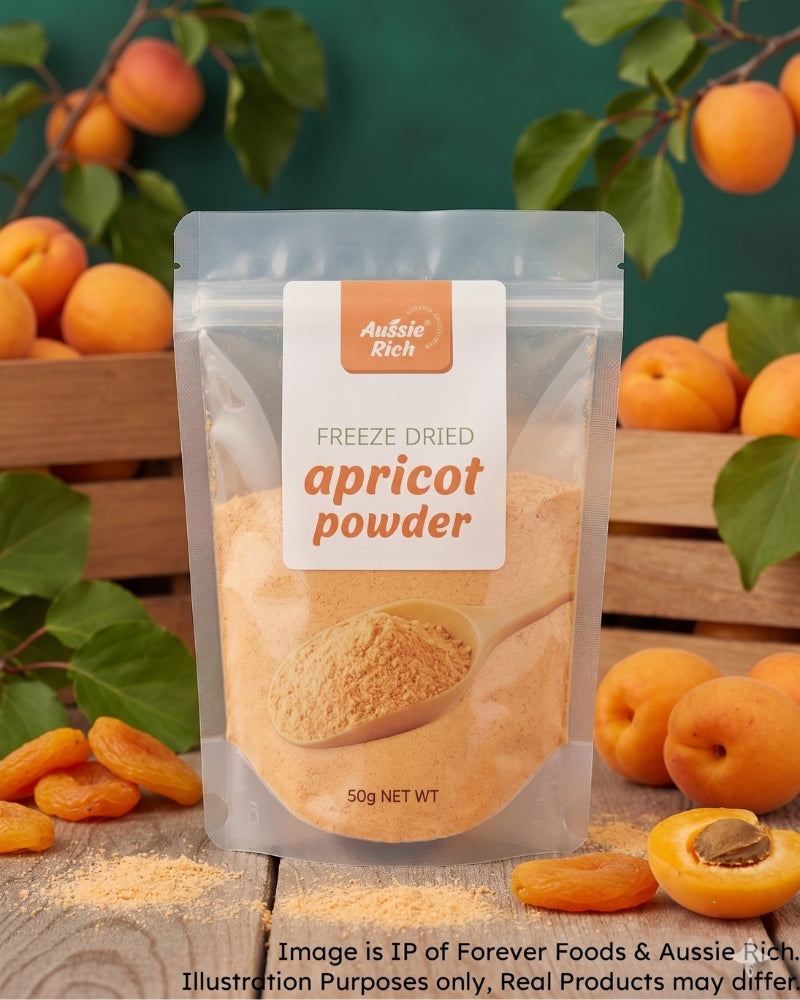 A stand-up pouch of Aussie Rich Freeze Dried Apricot Powder, surrounded by fresh apricots, green leaves, and wooden crates against a dark green background.