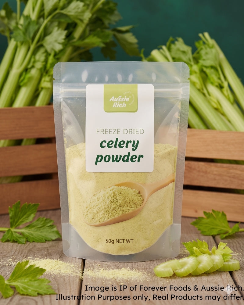 A 50g stand-up pouch of Aussie Rich Freeze Dried Celery Powder, displayed on a wooden surface with fresh celery stalks and leaves in the background.