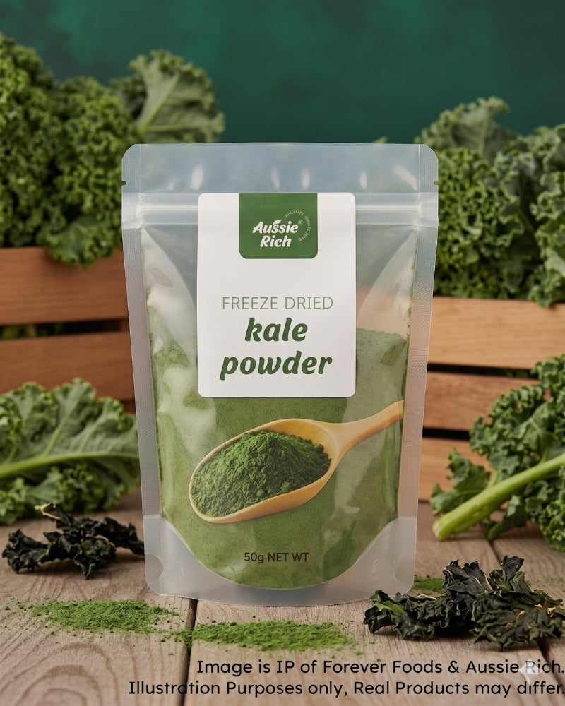 A stand-up pouch of Aussie Rich Freeze Dried Kale Powder, displayed on a wooden surface with fresh kale leaves and loose kale pieces around it.