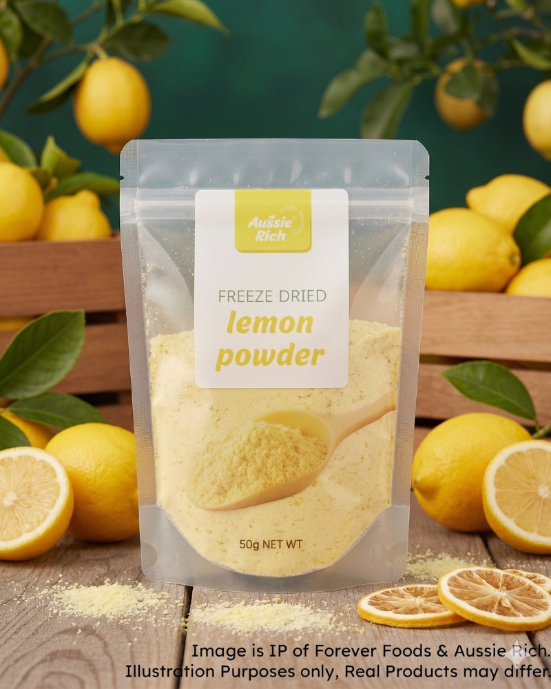A stand-up pouch of Aussie Rich Freeze Dried Lemon Powder, surrounded by fresh lemons, lemon slices, and wooden crates on a rustic wooden table. The pouch is clear, showing the pale yellow powder inside, with a white and yellow label.