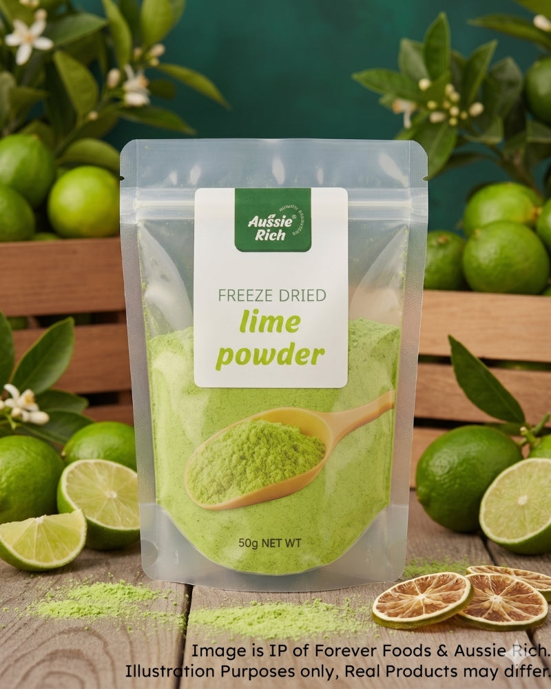 A stand-up pouch of Aussie Rich Freeze Dried Lime Powder, filled with bright green powder and featuring a wooden spoon graphic. The pouch is set on a wooden surface surrounded by fresh limes, lime slices, dried orange slices, and green leaves against a dark green background.