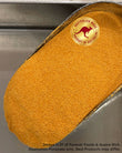 A close-up of a large oval container filled with fine Apricot Powder, on a metallic surface. A circular 'Australian Made Product of Australia' kangaroo logo is printed on the container, and a disclaimer watermark is visible at the bottom.